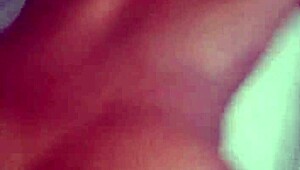 Mistress oils up her slaves for bed play