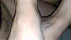 she gives a footjob until he cums on her pussy