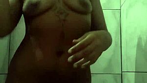 Watch This Naughty Brunette Novinha Exhibiting Herself in the Shower! She's Masturbating So Wildly.