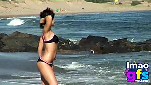 Hot brunette babe in lingerie on beach