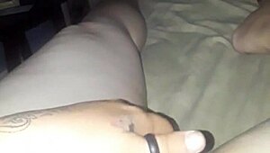 She casually masturbates her pussy in a relaxed home setting, building up to an intense solo session.