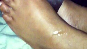 ebony babe gives a footjob in this amateur mov