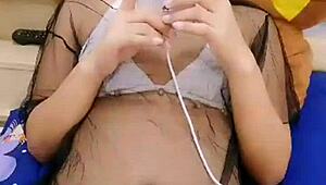 asian stripper teasing with clothes ripped during striptease