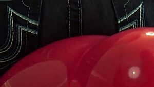 Hey, watch Fifi Foxx sit and pop balloons topless