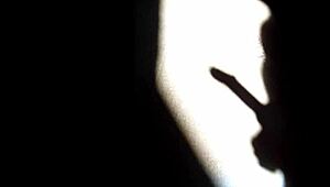 she masturbates in the shadows, playing with herself