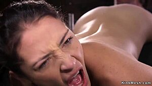 Mummified Brunette Endures Intense Whipping