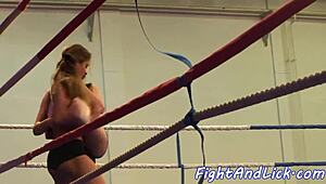 Busty Beauties Clash in Naked Wrestling Showdown.