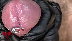 Watch this close-up of latex gloves teasing the peehole before a horny cumshot explodes.