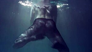 Lozhkova lounges in see-through shorts by the pool