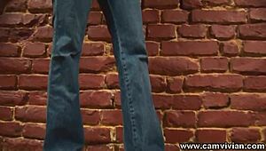 wearing denim jacket and jeans with pigtails for solo striptease