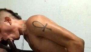 Well-Endowed Gay Guy Sucks Big Black Cock at Gloryhole