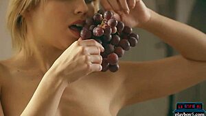 Perfect blonde babe Margo Dumas shows off her big round ass in a striptease