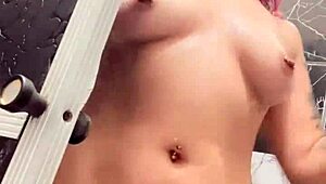 Sko ella boldly shows off her pussy, boobs, and tattooed tits in the shower