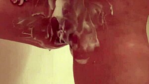 Blonde Petite Emi Clear Shaves Legs and Tiny Pussy in Bath