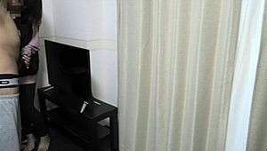 Young Couple Has Intimate Moments In Living Room Before School