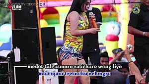 indonesian singers perform wild erotic dance on stage with eager crowd