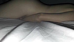 latina wife rubs her wet pussy on bed for intense orgasm