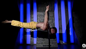 hot young gay guy performs acrobatic strip tease, ripping clothes while dancing on the pole