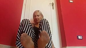 hey, stepson, your blonde stepmom’s feet are killing her. wanna help out with a quick rub?