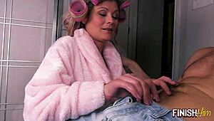 Milf in hair rollers gives early morning handjob to finish quick.