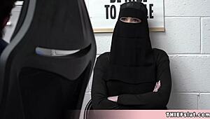 Cute Muslim chick caught hiding stolen goods under her outfit