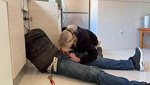 hot wife gives blowjob to plumber in kitchen, ends with cum in mouth