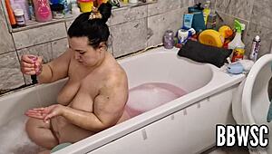 Pervert spies on BBW milf washing giant floppy tits in bath