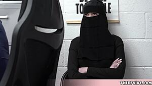 Cute Muslim chick caught hiding stolen goods under her outfit