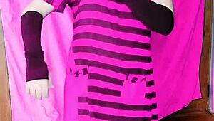 Pink shirt and black mini skirt on a sissy crossdresser with white legs