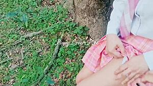 Student in forest points at blade