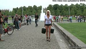 Busty blonde flaunts wet shirt in daring public display