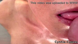 Housewife with big tits gives a sloppy blowjob while he watches porn on laptop. Massive cum in mouth!