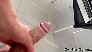 Housewife with big tits gives a sloppy blowjob while he watches porn on laptop. Massive cum in mouth!