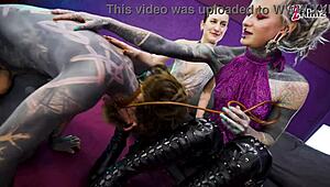 heavy tattooed sub pegged by dominas