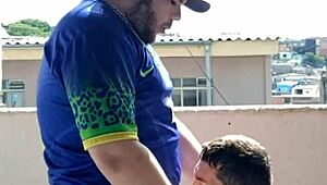 tbt eating young guy outdoors with audience watching.