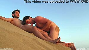 Gay nudist teases with blowjob on beach almost gets caught fucking