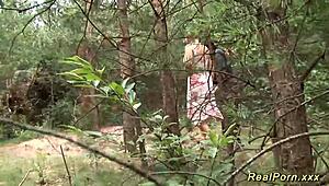 Busty German stepmom takes a black cock banging outdoors in wild group action.