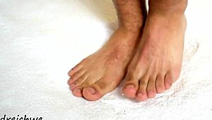 the sexy gay man shows off his huge high definition feet