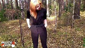 This redhead girl got sucked and banged hard out in the forest.