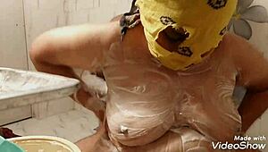 Big-boobs wife massaging hubby with tits in garage, then blowjob.