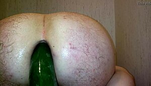 gay guy experiments with a vegetable in the shower