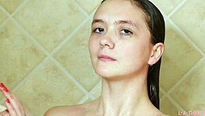 Charming Brunette Model Strips and Showers for Photoshoot