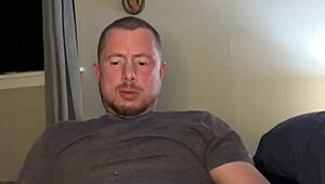 Flexible guy masturbates with plug