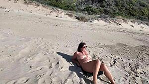 Curvy Nudist Stranger Teases with Dildo on Public Beach