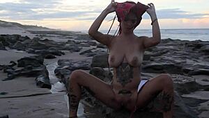 Just chilling while teen lesbians hit orgasm during beach massage