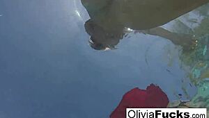 Olivia strips down for steamy solo fun in the pool. Her blonde curves shine under the summer sun.