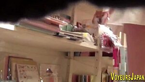 Wow, this Asian babe in big boots gets peed on by a sneaky voyeur! 😲