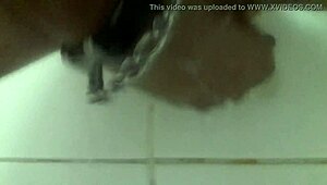 In the shower, he pleasures himself with a dildo