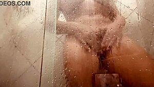 milf films herself cleaning hairy pussy in steamy bathroom