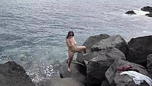 Unexpected cumshot hits nudist girlfriend's face on beach while cuckold watches!